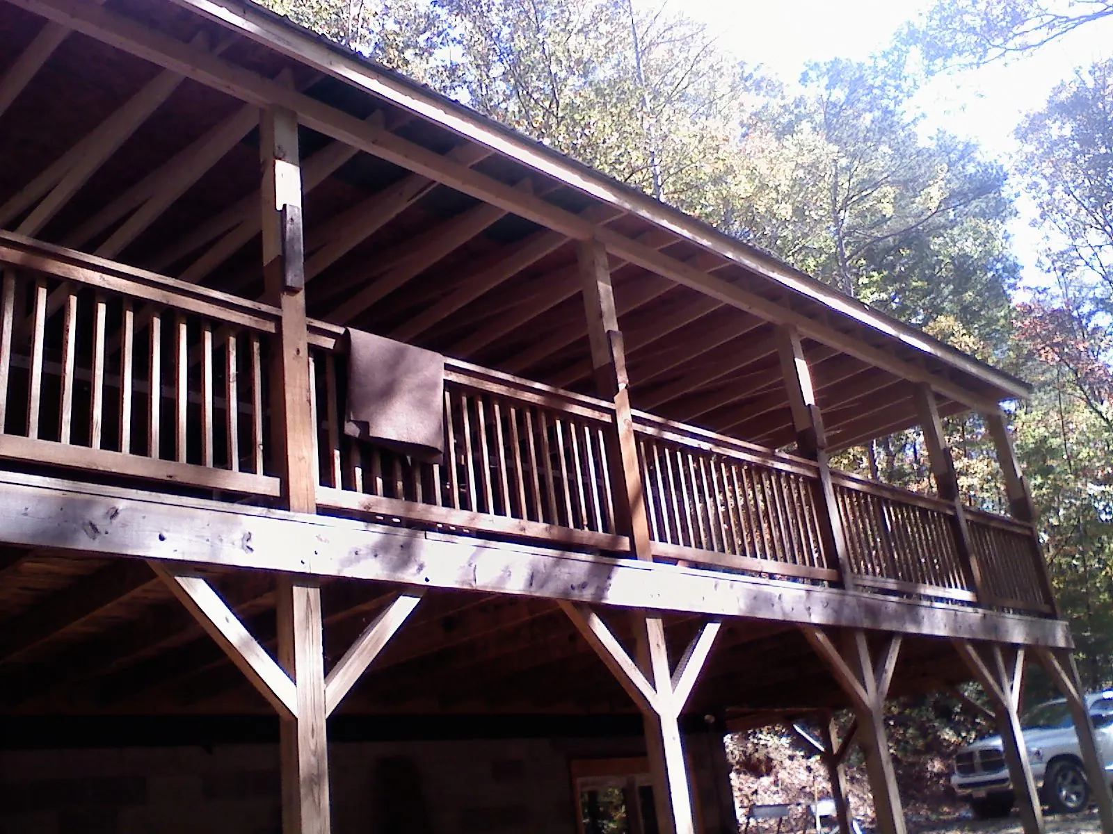 Timber framing under a new elevated porch and deck — Roof Leak Repair in Suffolk by Roofing Brothers